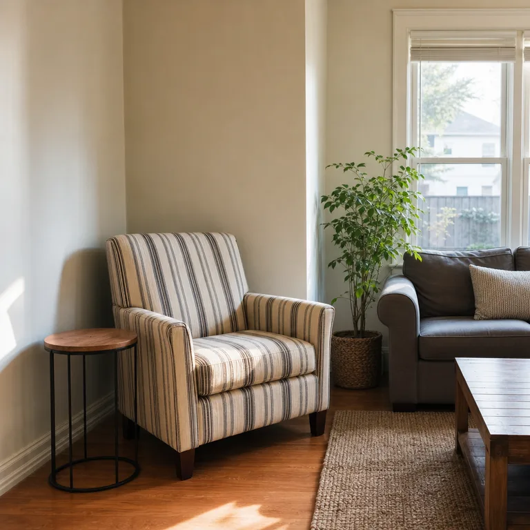 A single striped accent chair creating a focal point in a living room corner.