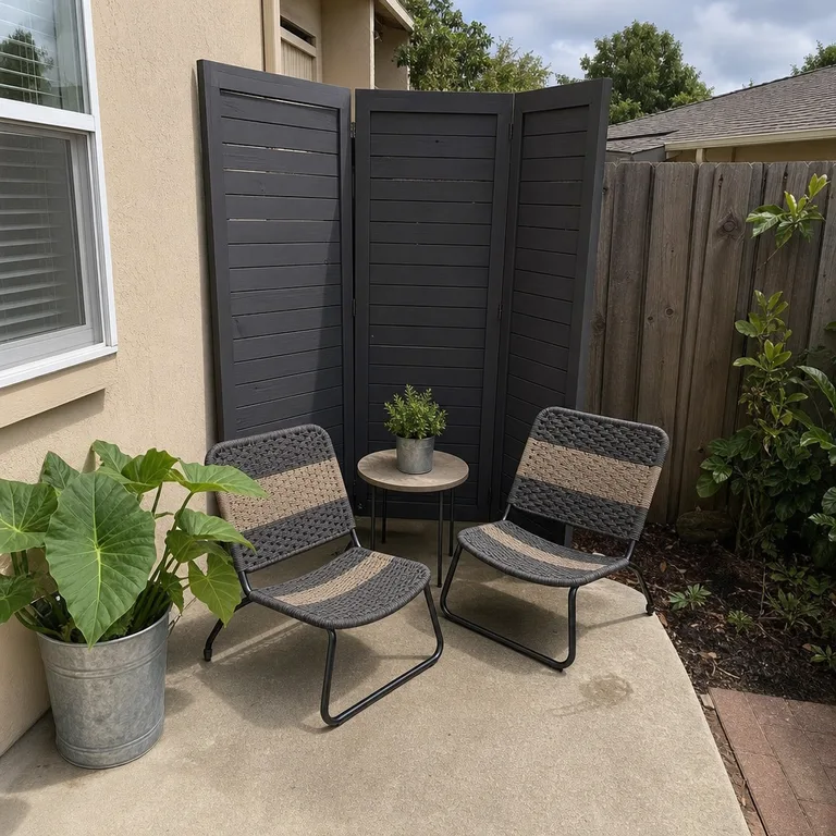 An angled folding screen gives two patio chairs privacy without enclosing the patio.
